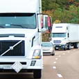Semi truck in lead on road