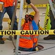 Man harnessed going into confined space for construction