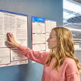 woman looking at labor law posters on wall