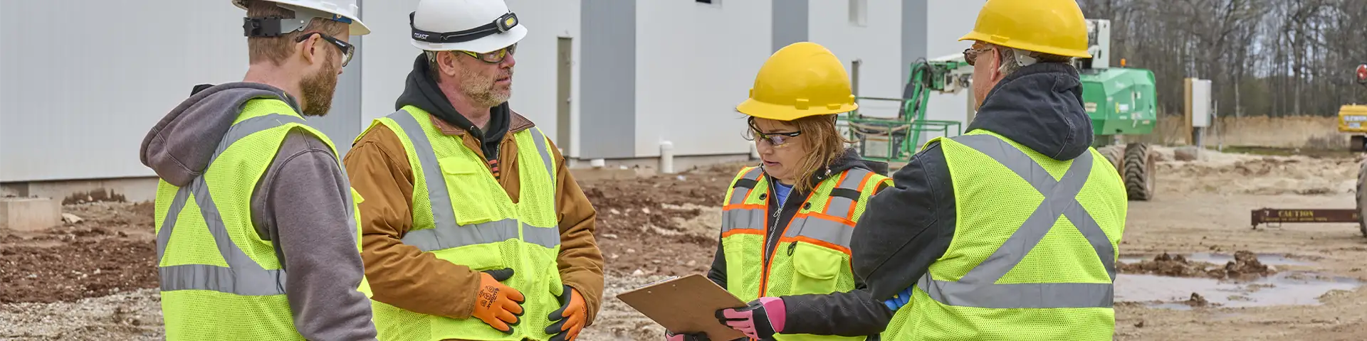 Workers gathered on site in proper PPE