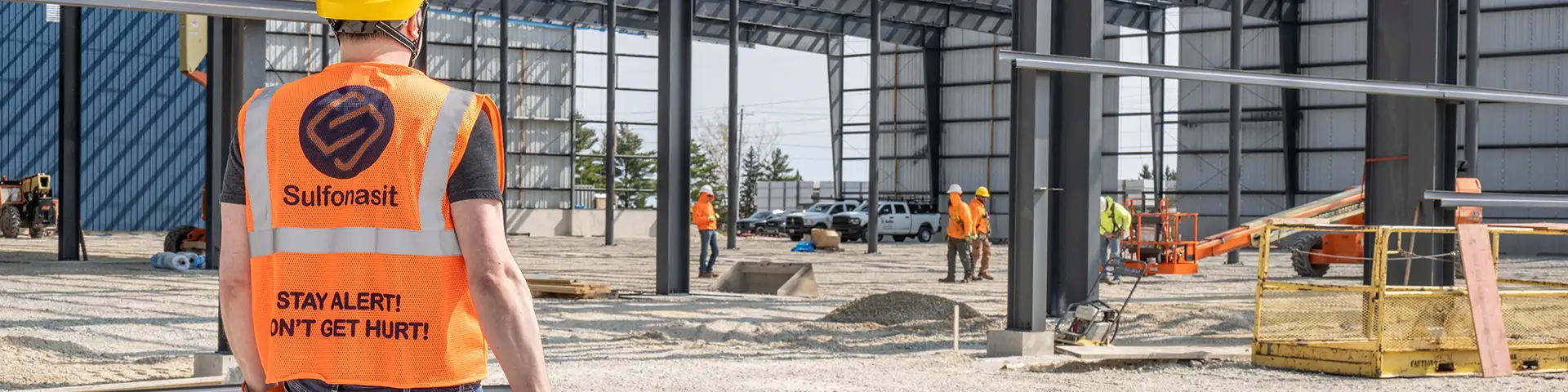 Workers gathered on site in proper PPE