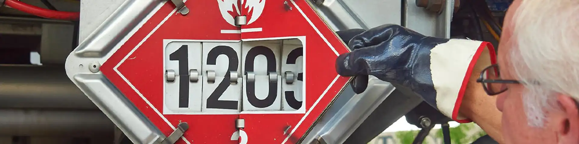 Man adjusting flammable flip placard.